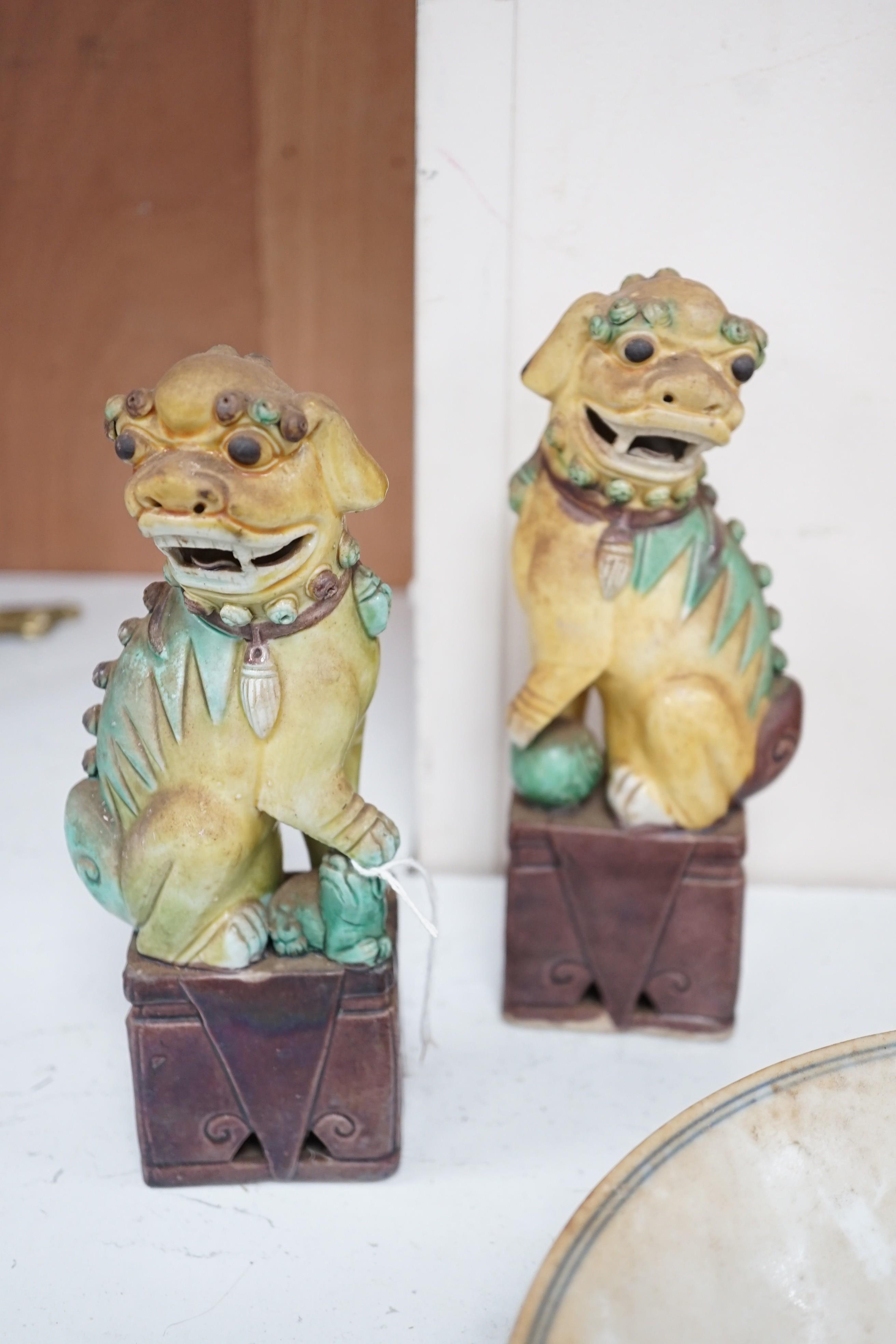 A pair of Chinese sancai lion dogs, together with a Chinese Republic period famille rose vase and bowl